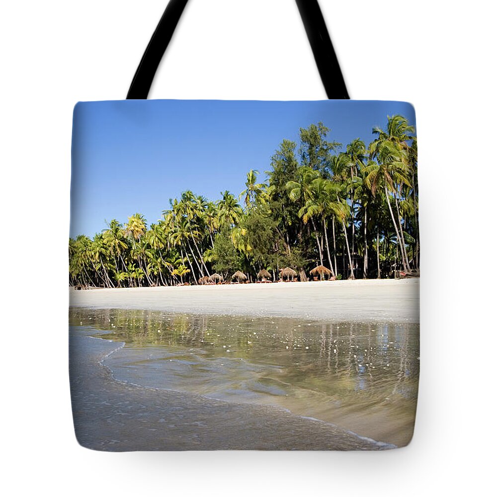 Tropical Tree Tote Bag featuring the photograph A Beautiful Tropical Beach With Palm by Mihau