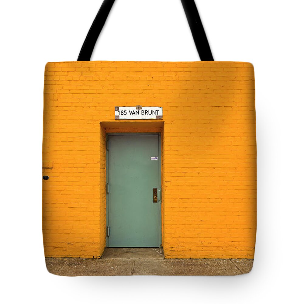 Orange Color Tote Bag featuring the photograph A Door In Van Brunt Street by Maremagnum