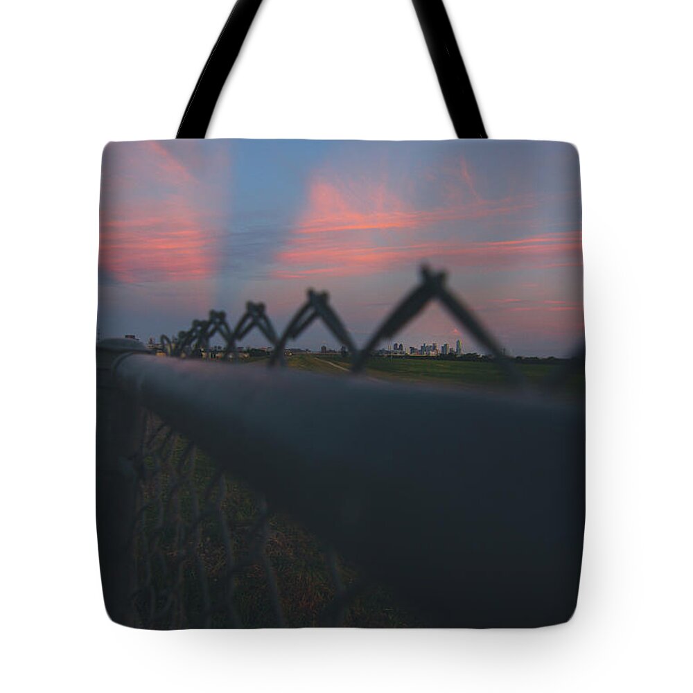 Fence Tote Bag featuring the photograph A Fence by Peter Hull