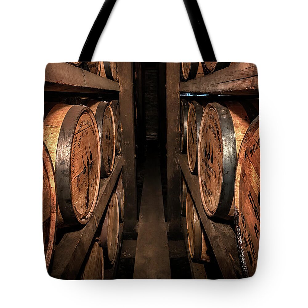 Woodford Reserve Tote Bag featuring the photograph A Peek Between the Ricks by Susan Rissi Tregoning