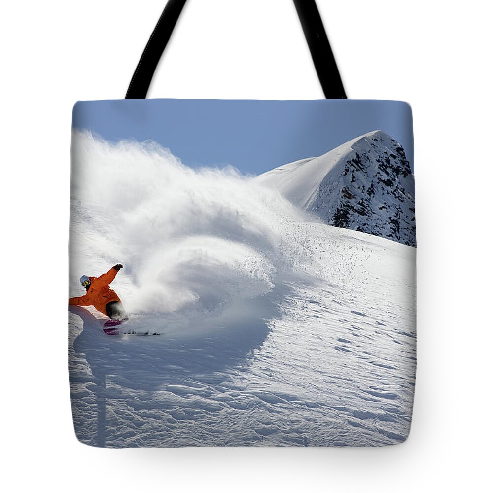 A Snowboarder Carving In Powder Tote Bag