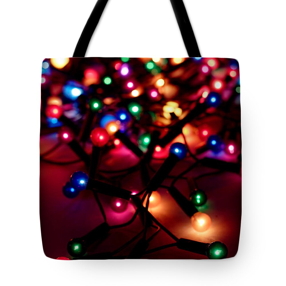 Holiday Tote Bag featuring the photograph A String Of Christmas Lights Out For by Fizia