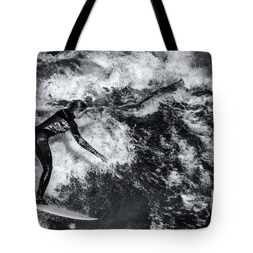 Surfer Tote Bag featuring the photograph A Surfer At Eisbachwelle, Munich - Monochrome by Philip Preston