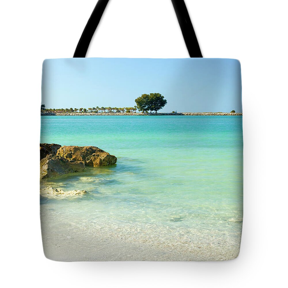 Clearwater Tote Bag featuring the photograph A View Of A Clear Beach During A Summer by Bluehill75