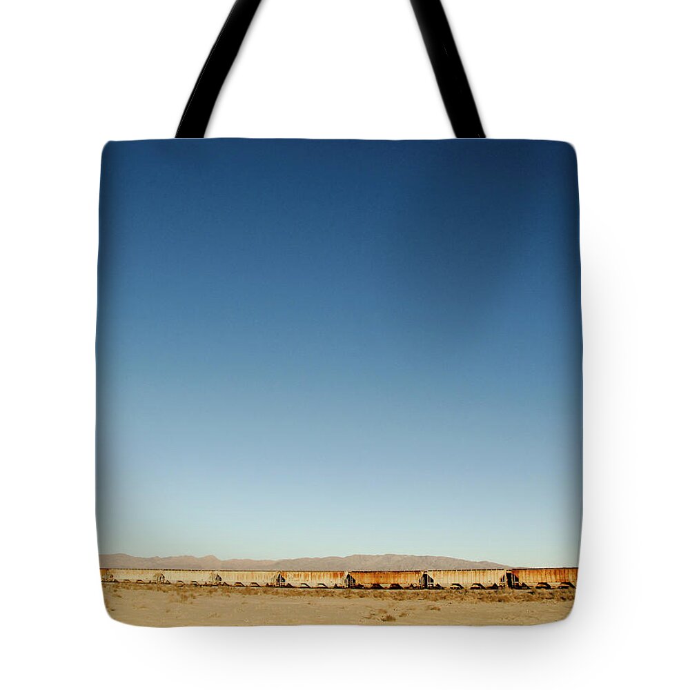 Rail Freight Tote Bag featuring the photograph Abandoned Freight Train In Death Valley by Bill Boch