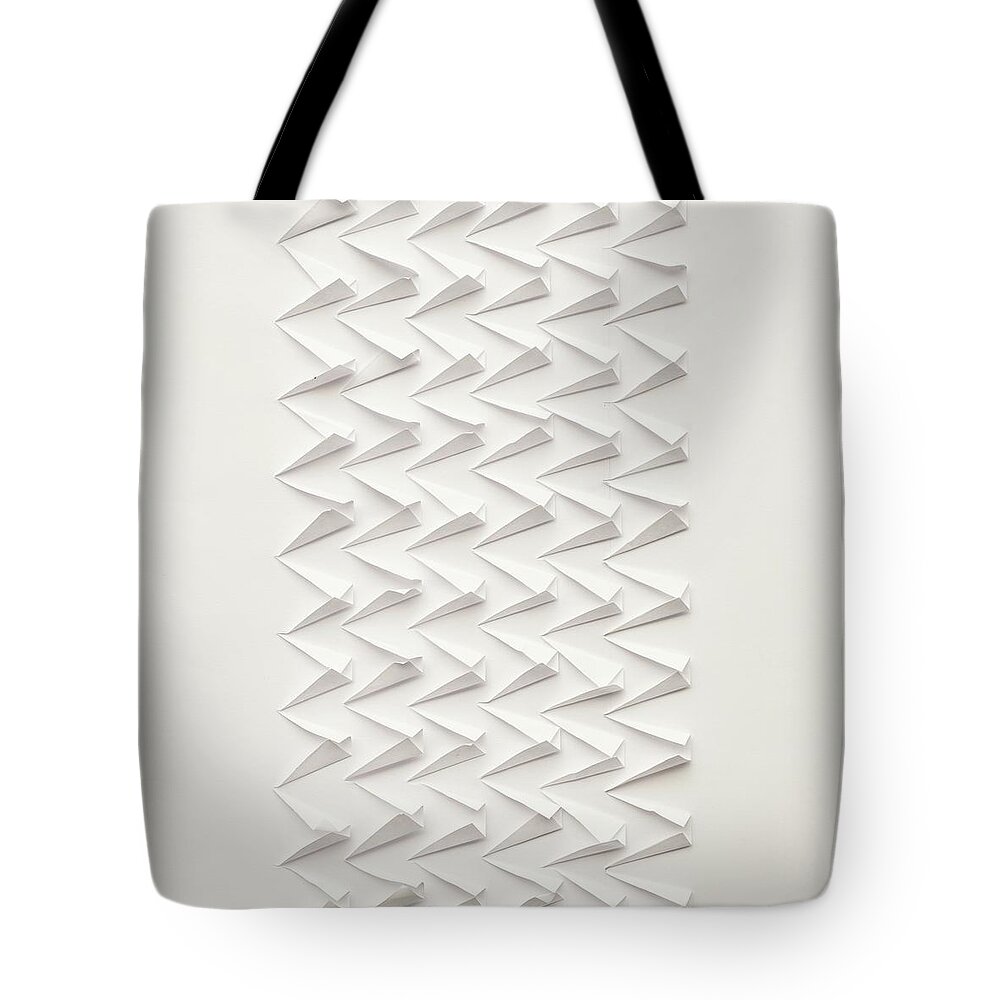 White Background Tote Bag featuring the photograph Abstract Paper Design In White by Michael Adendorff