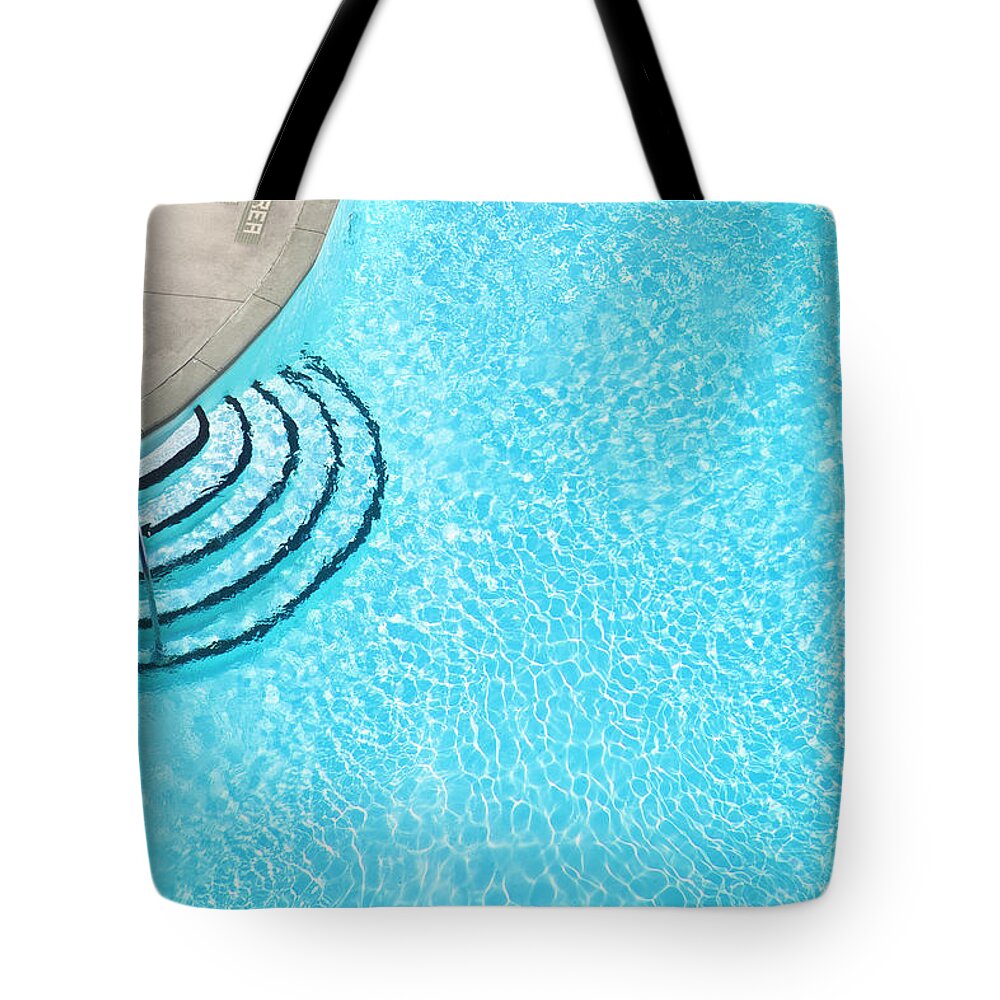 Recreational Pursuit Tote Bag featuring the photograph Aerial View Of A Resort Swimming Pool by Pgiam