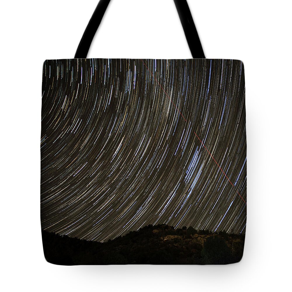 Night Tote Bag featuring the photograph Airplane Thru Star trails by Paul Freidlund