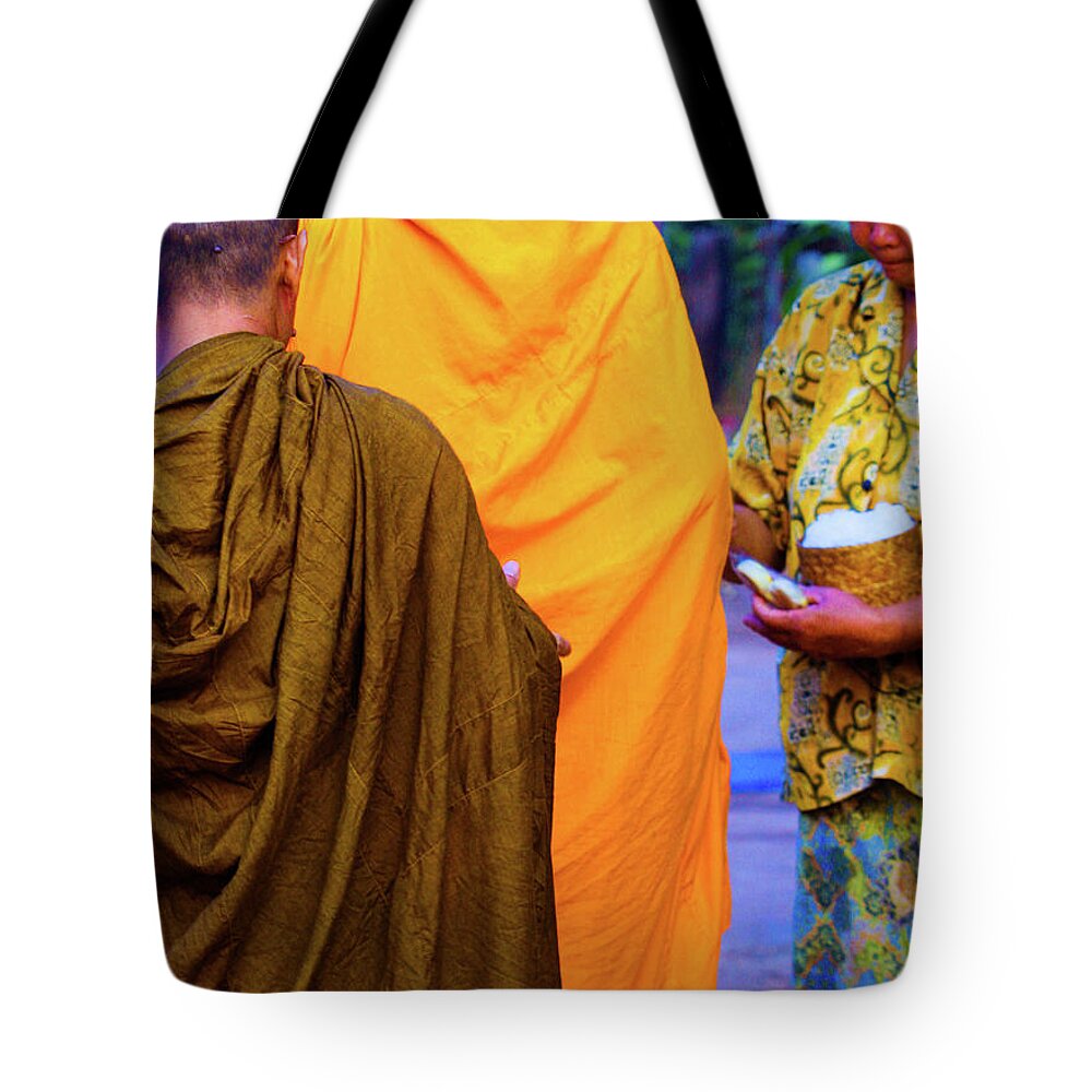Books Tote Bag featuring the photograph Alms for the monks by Jeremy Holton