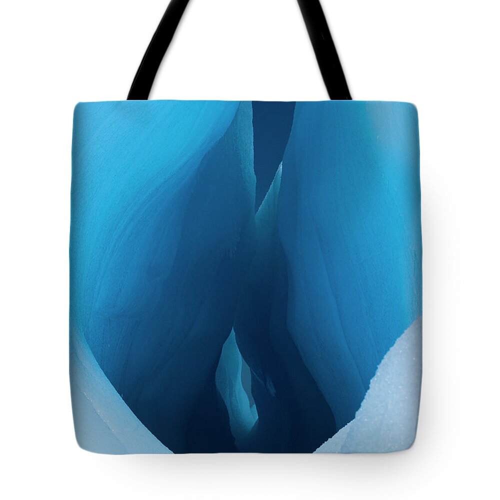 Melting Tote Bag featuring the photograph An Iceberg With A Deep Crevasse Or by Mint Images - Art Wolfe