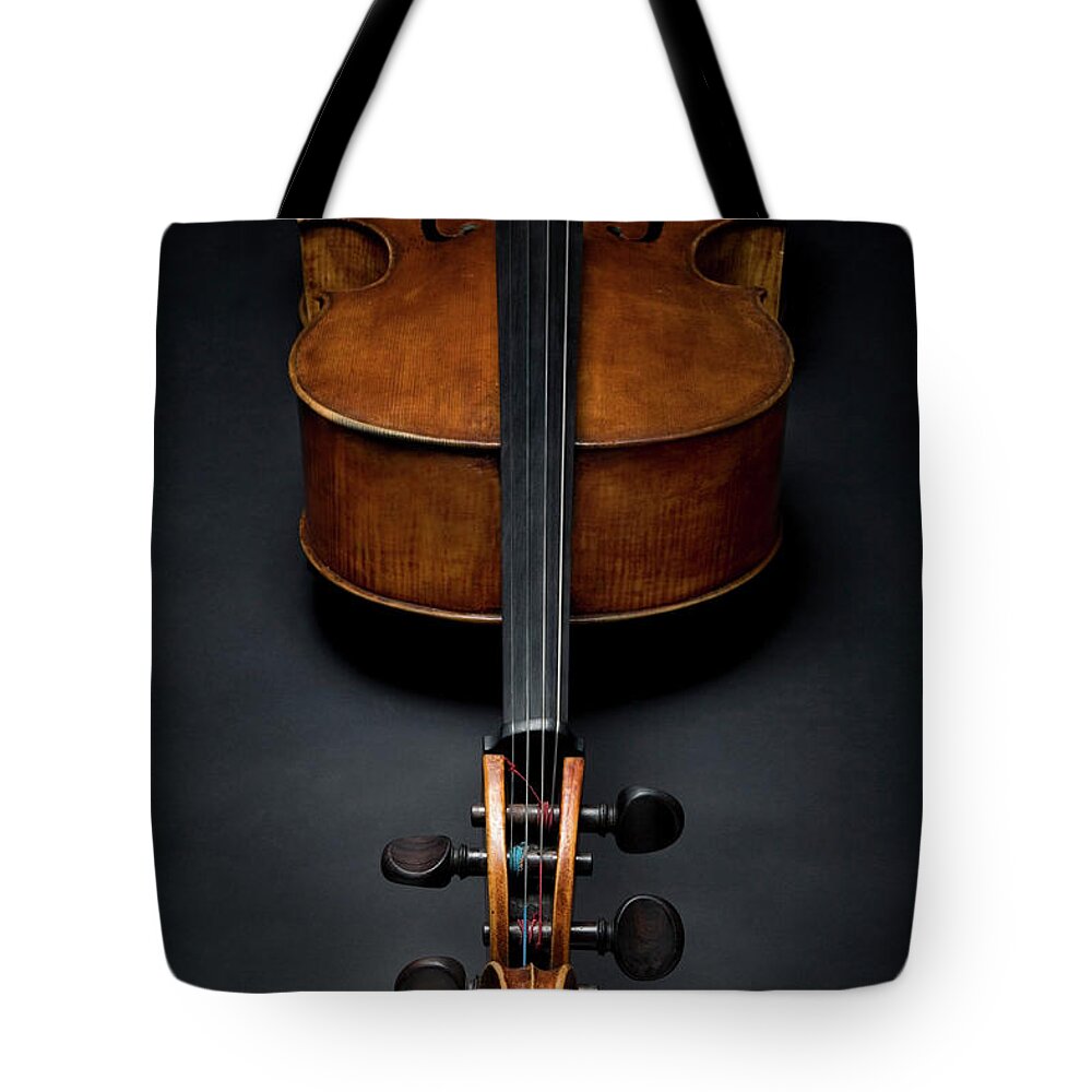 Music Tote Bag featuring the photograph Antique Cello On The Floor by Jonnie Miles
