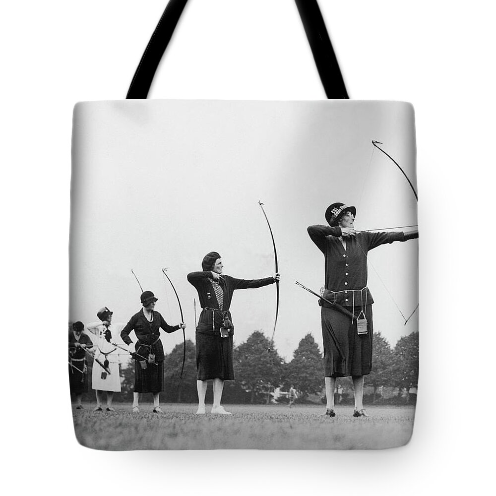 Mid Adult Women Tote Bag featuring the photograph Archive Shot Row Of Female Archers by Fpg