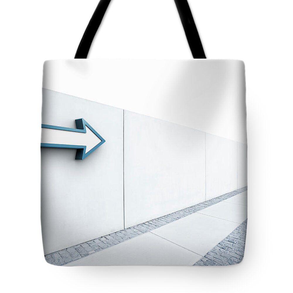 Outdoors Tote Bag featuring the photograph Arrow Pointing Into Distance by Jorg Greuel