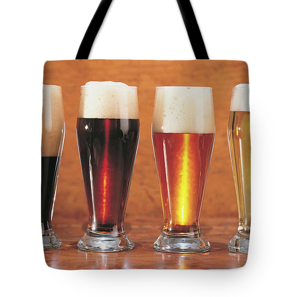 Stout Tote Bag featuring the photograph Assorted Beers And Ales by Comstock