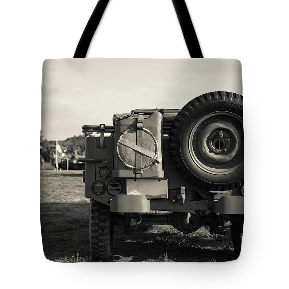 World War Ii Tote Bag featuring the photograph Back of a World War II era Military US Army Jeep by Edward Fielding
