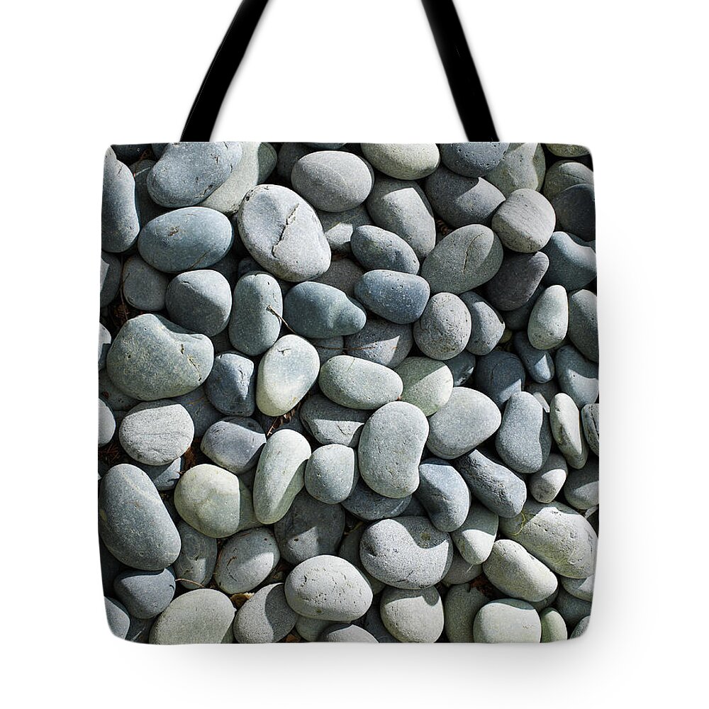 Bellingham Tote Bag featuring the photograph Background Of Gray Stones by Ryan Mcvay