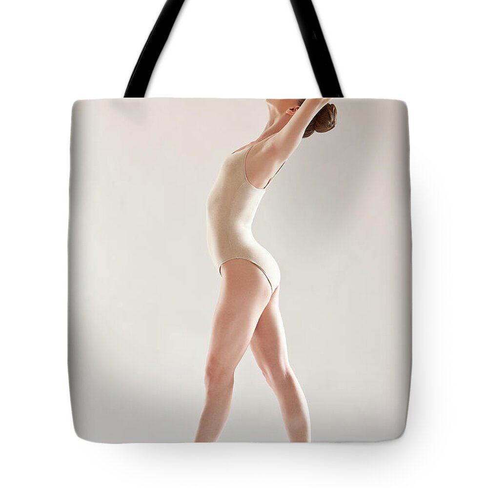 Ballet Dancer Tote Bag featuring the photograph Ballerina by Rollover