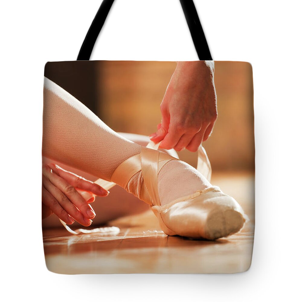 Expertise Tote Bag featuring the photograph Ballet Dancer In Dance Studio, Foot by Yinyang