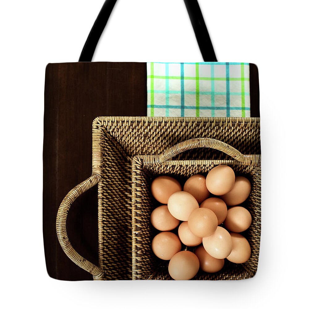 Large Group Of Objects Tote Bag featuring the photograph Basket Of Brown Eggs by Joey Celis