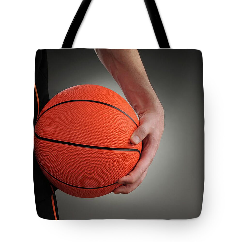People Tote Bag featuring the photograph Basketball Player by Mumininan