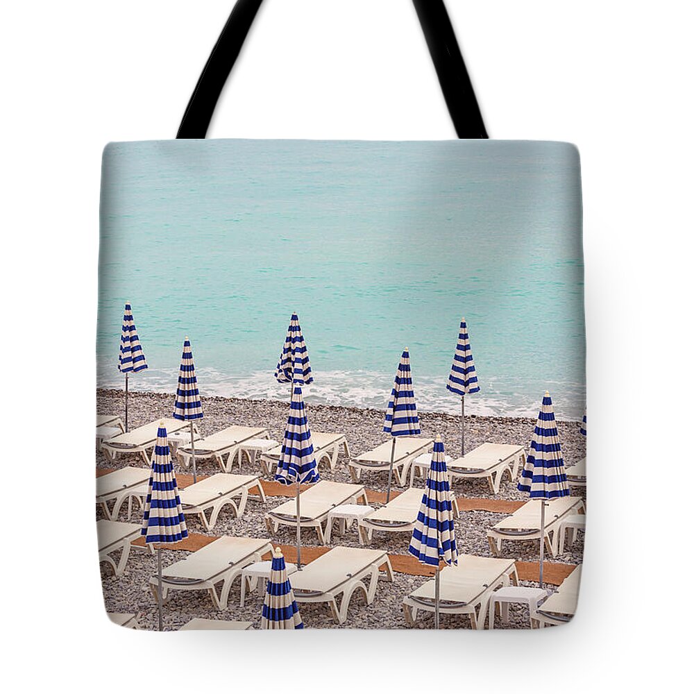 Beach Umbrellas In Nice Tote Bag featuring the photograph Beach Umbrellas in Nice by Melanie Alexandra Price