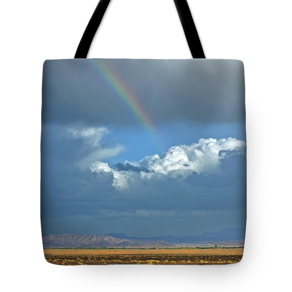 Scenics Tote Bag featuring the photograph Beautiful Rainbow And Storm In Desert by Pavliha