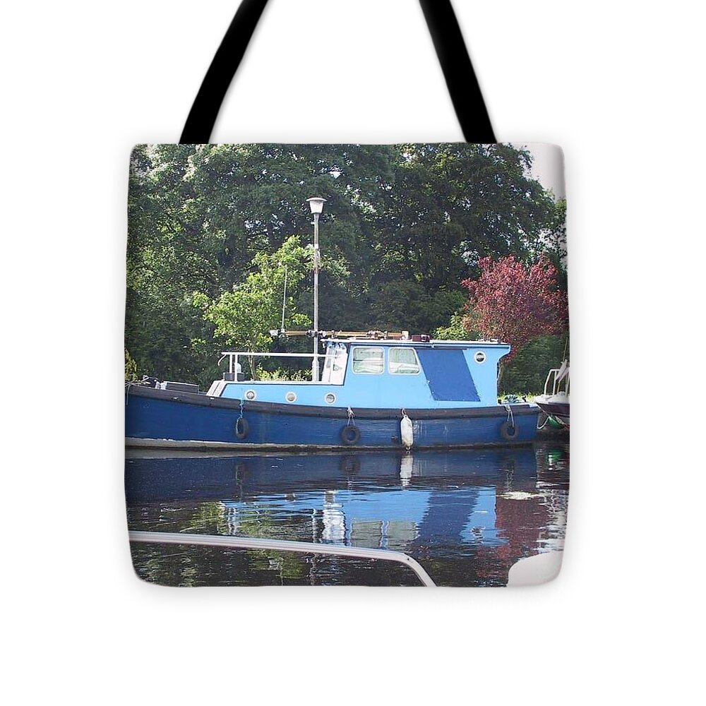  Tote Bag featuring the painting Blue Boat at Cloondara Harbour. by Val Byrne