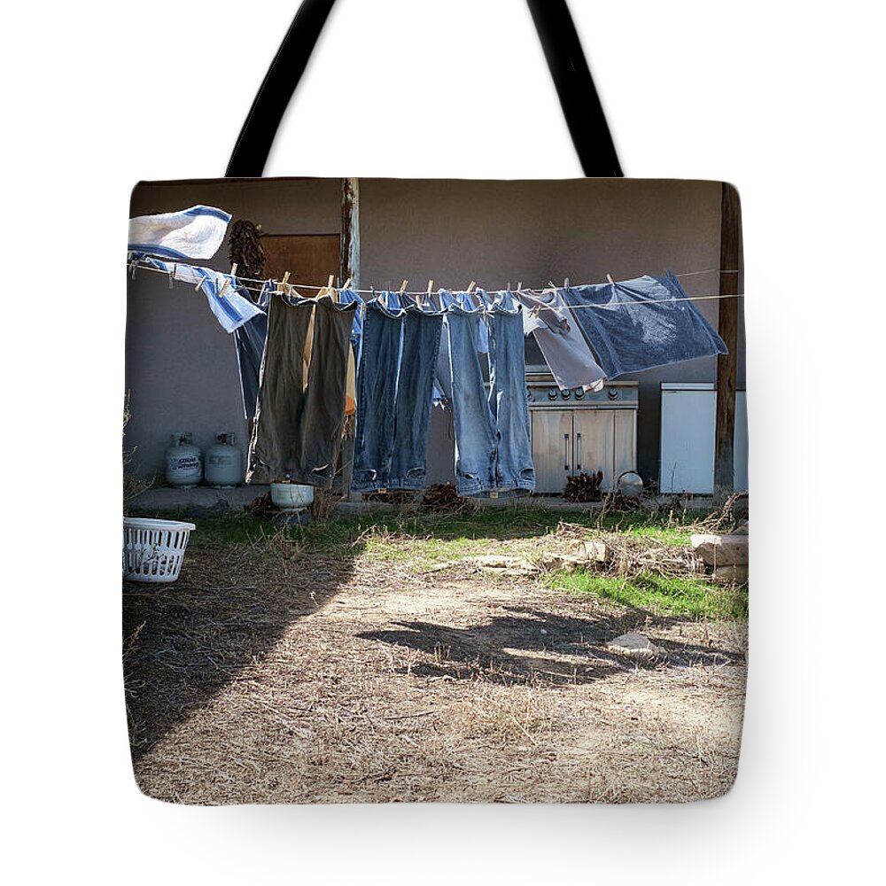 Rural Scenes Tote Bag featuring the photograph Blue Jeans Clothesline by Mary Lee Dereske