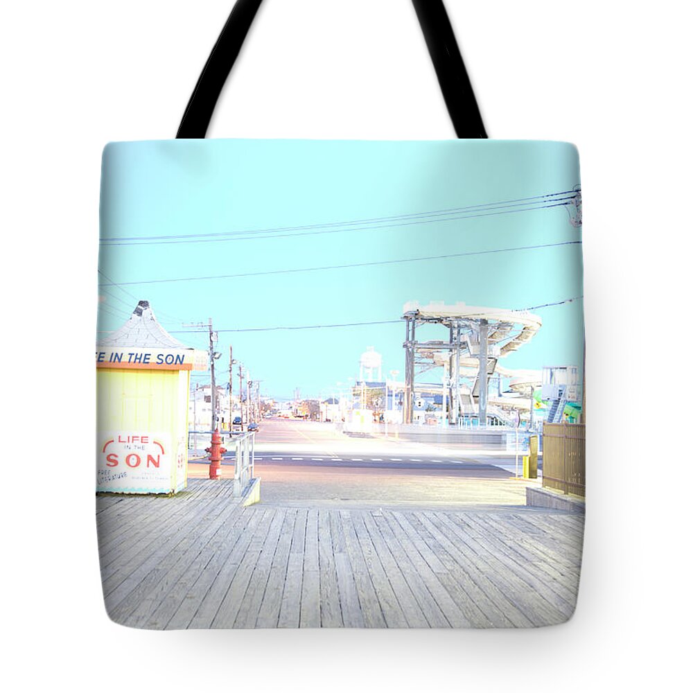 Tranquility Tote Bag featuring the photograph Boardwalk And Amusement Rides In by Michael Duva