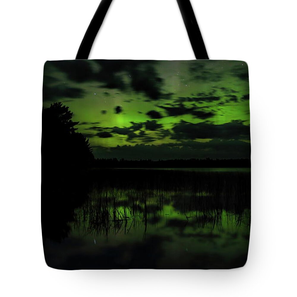 Aurora Borealis Tote Bag featuring the photograph Boot Lake Green And Purple Northern Lights by Dale Kauzlaric