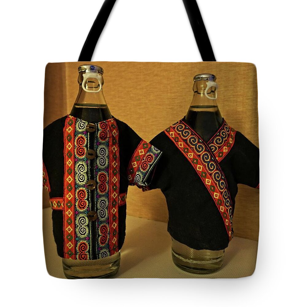 Bottle Covers Tote Bag featuring the photograph Bottle covers by Martin Smith