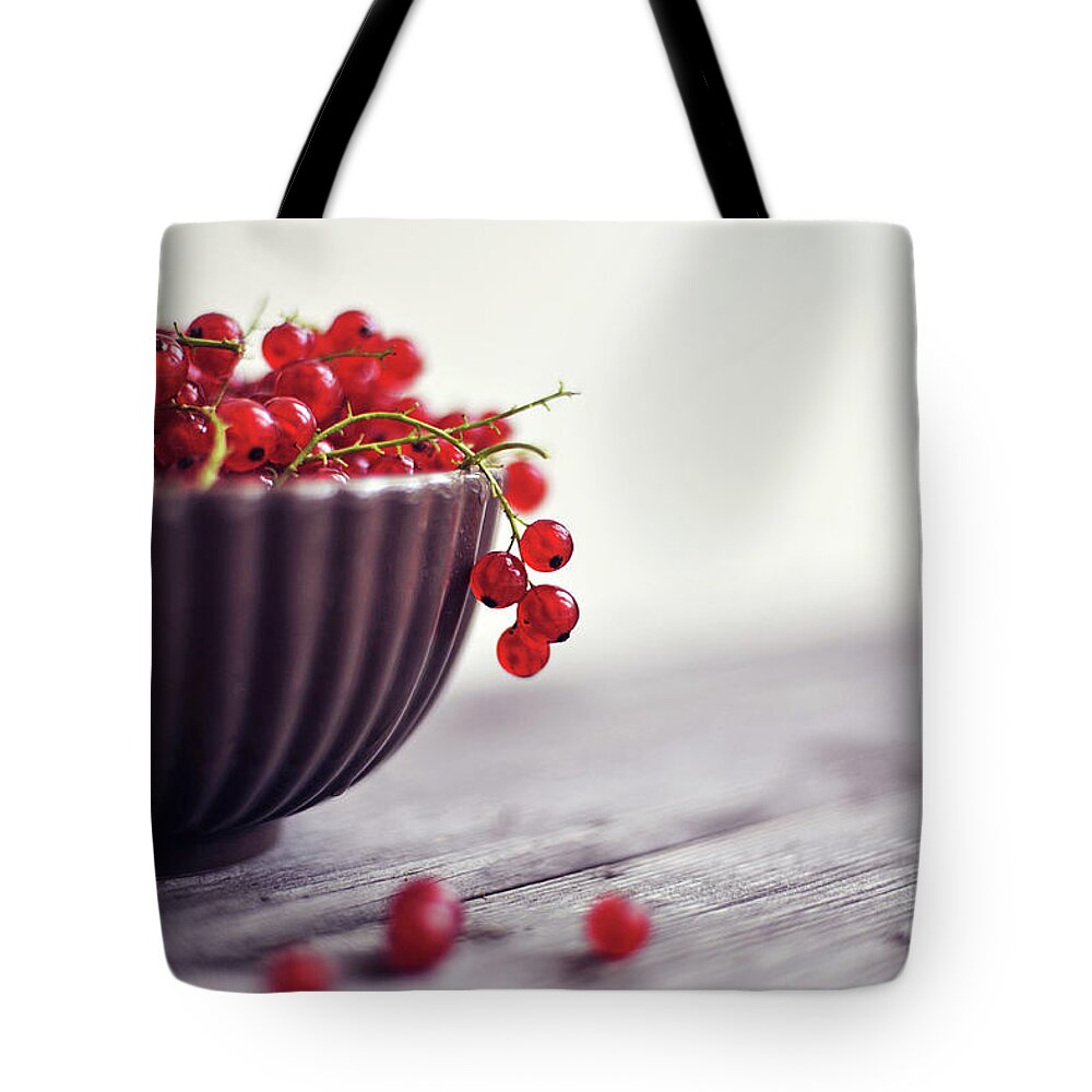 Red Currant Tote Bag featuring the photograph Bowl Full Of Berries by = Blue Spoon =