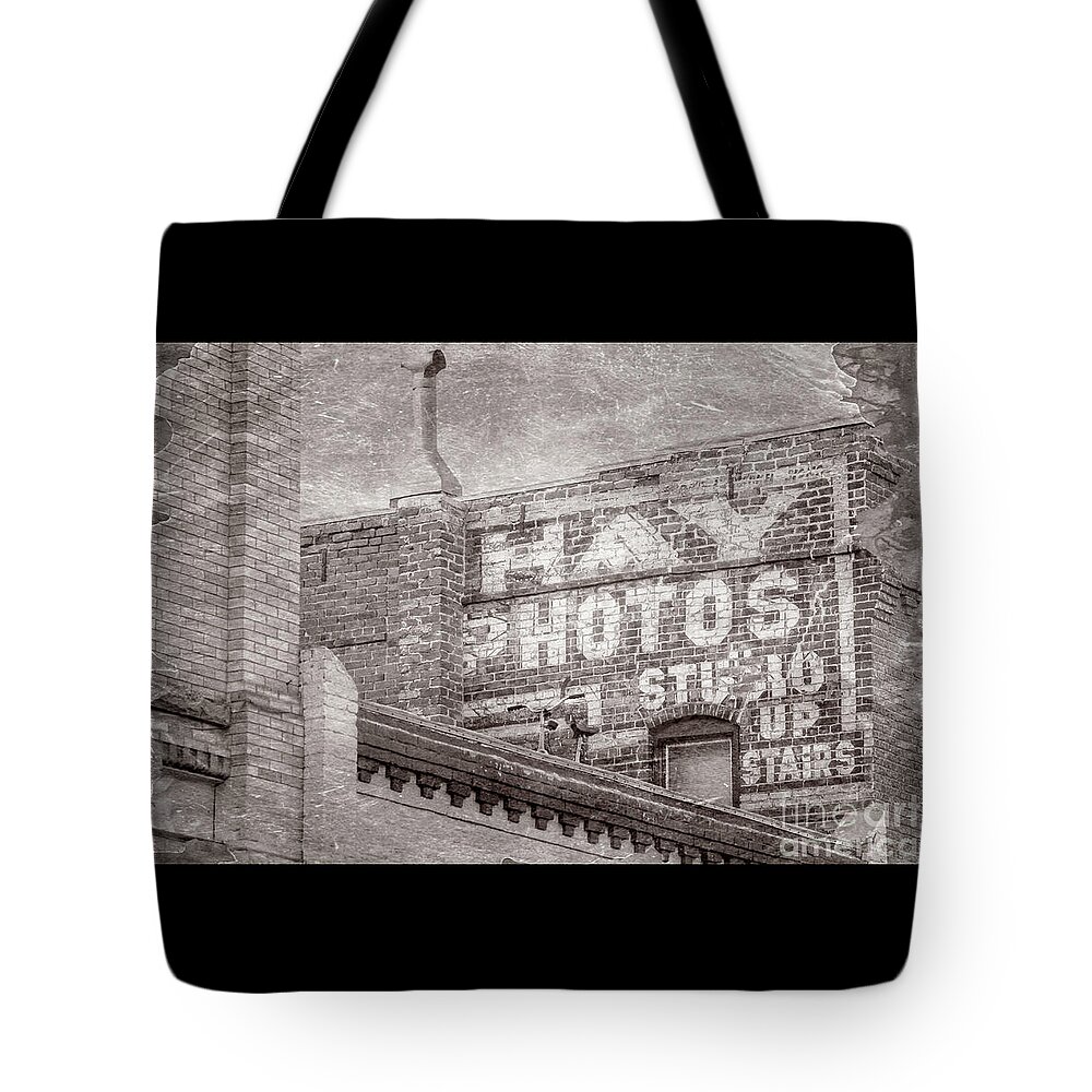 Brick Wall Advert Tote Bag featuring the photograph Brick Wall Advert by Imagery by Charly