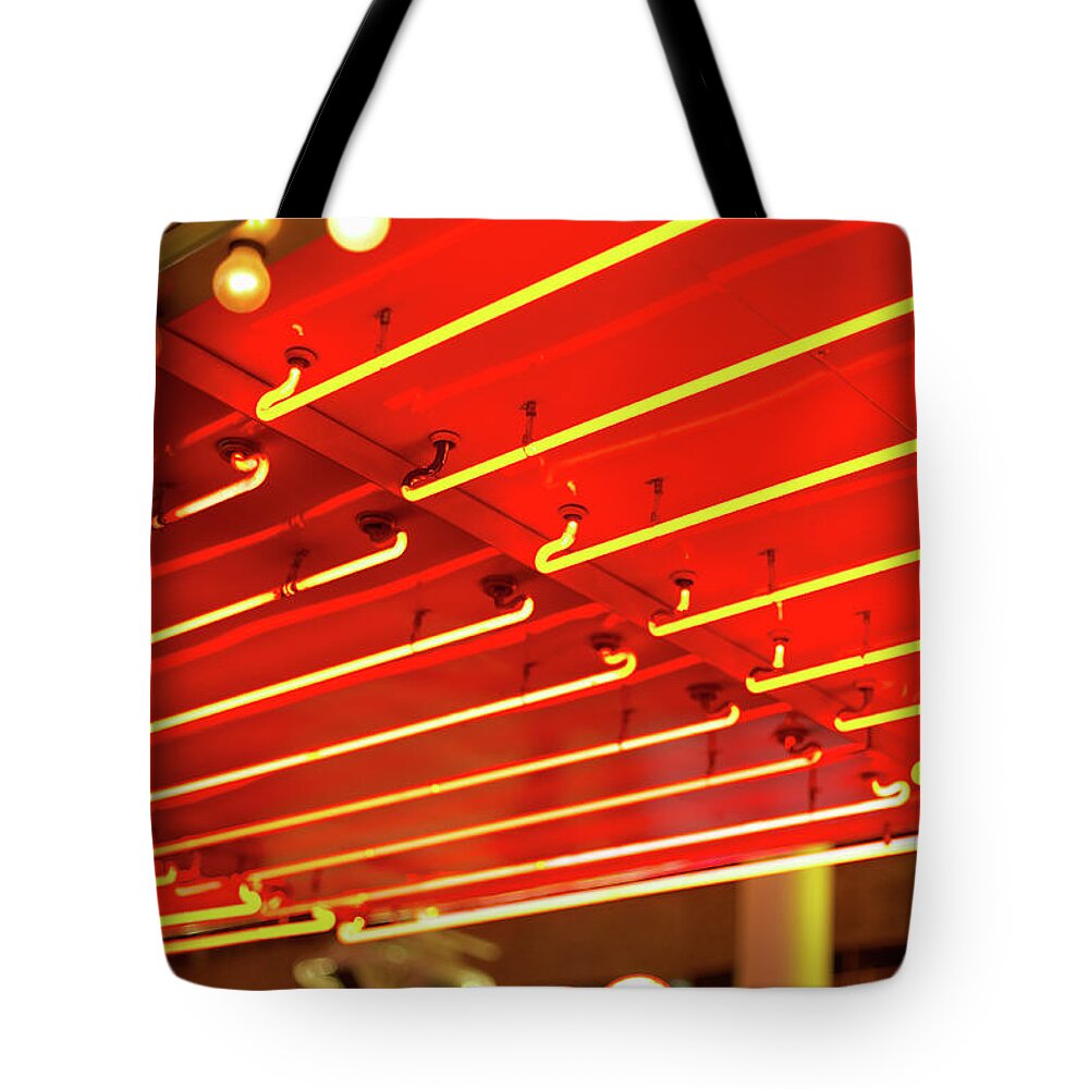 Outdoors Tote Bag featuring the photograph Bright Neon Lights In Front Of Casino by Jupiterimages