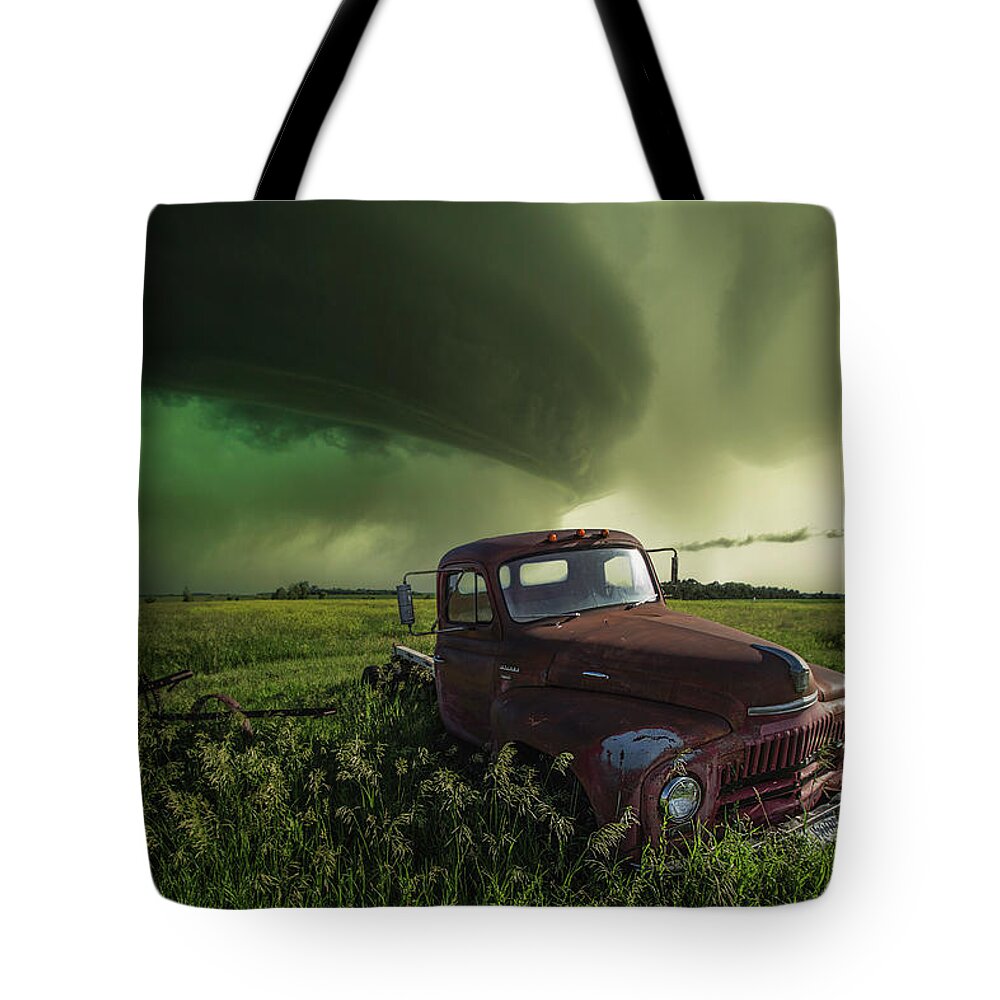 Old Truck International L 130 Pickup Rust Decay Abandoned Forgotten Shelf Cloud Hail Core Scary Dangerous Storm Thunderstorm Usa Top Best Wbpa Severe Weather Aaron Groen Storm Chase Grass Canon Rain Hail Warned Tote Bag featuring the photograph Broke by Aaron J Groen