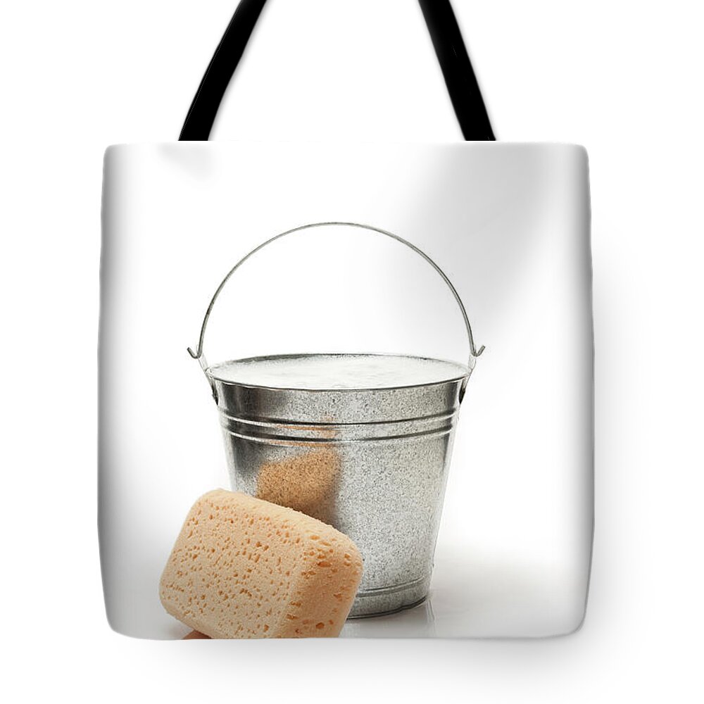 Shadow Tote Bag featuring the photograph Bucket Of Water And Sponge For Cleaning by Graphicola