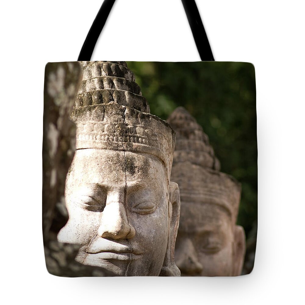 Engraving Tote Bag featuring the photograph Buddha Head Sculpture In A Row by Joakimbkk