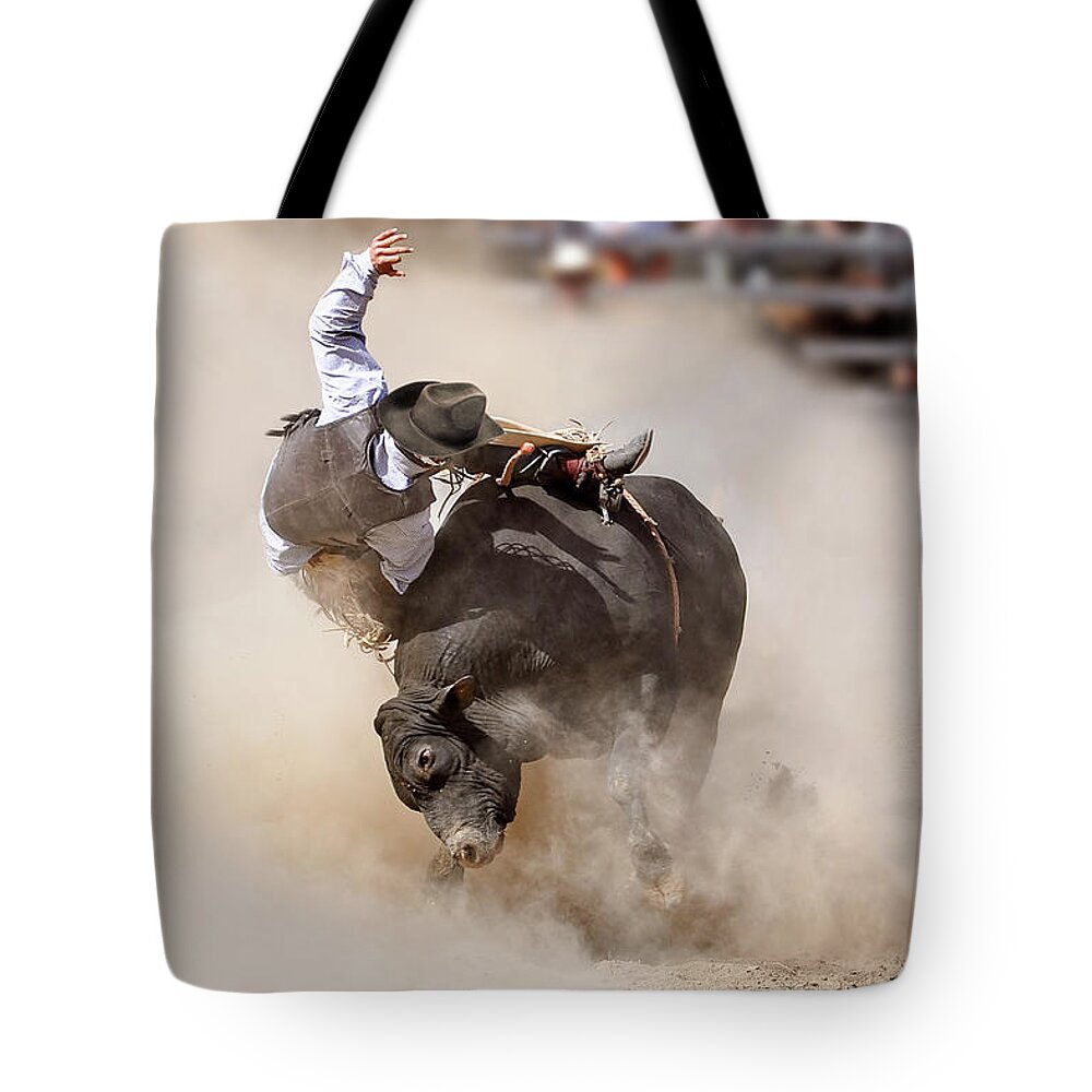 Rodeo Tote Bag featuring the photograph Bull riding, rodeo by Delphimages Photo Creations