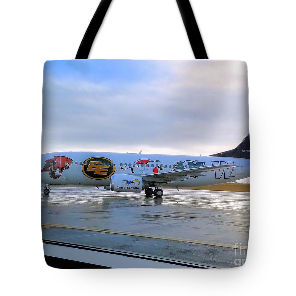 Airplane Tote Bag featuring the photograph Canadian Football League official plane  by Elaine Manley