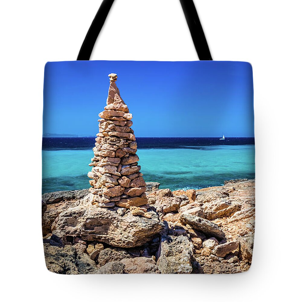 Stone Pile Tote Bag featuring the photograph Cap de Ses Salines, Mallorca, Spain by Lyl Dil Creations