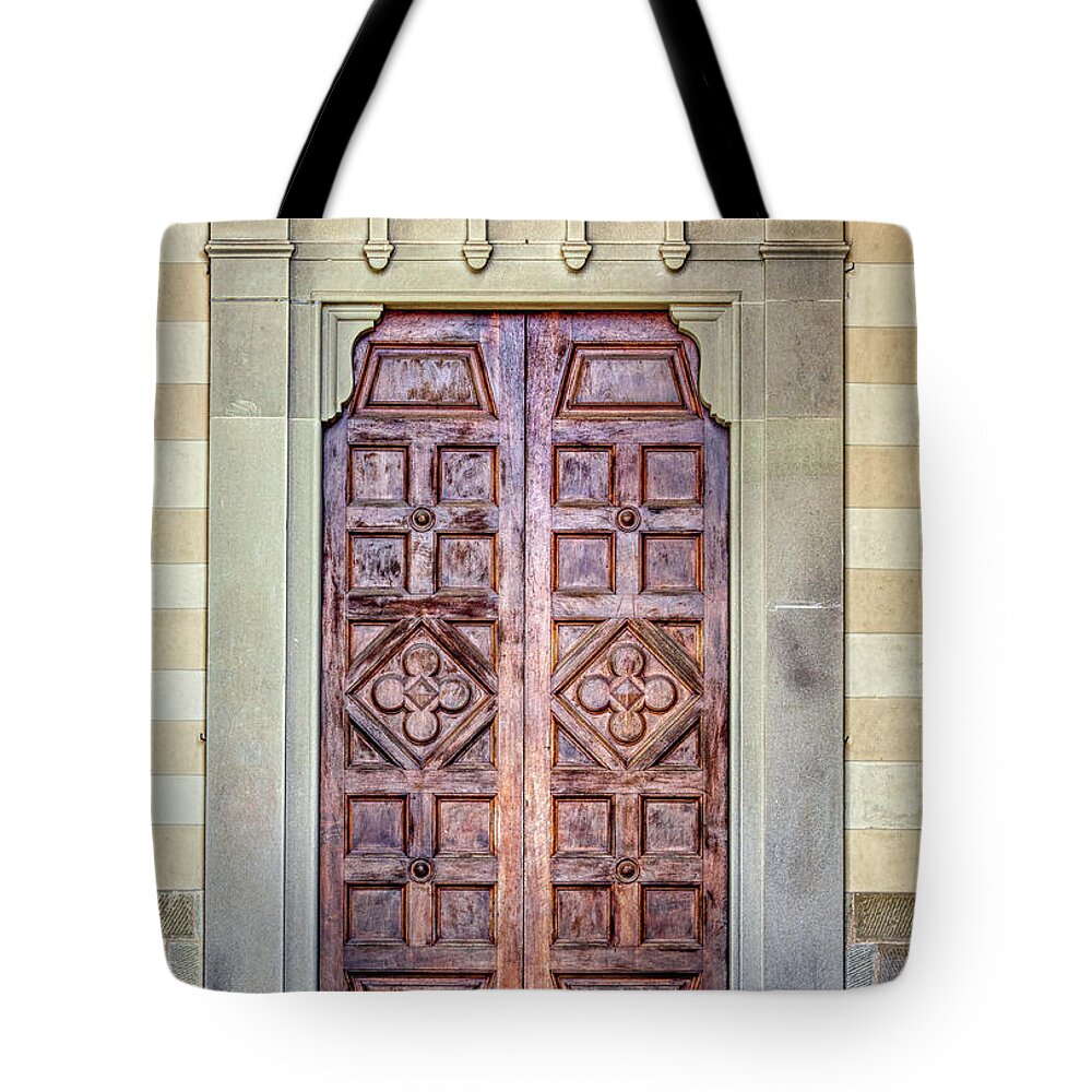 Medieval Tote Bag featuring the photograph Carved Door of Cortona by David Letts