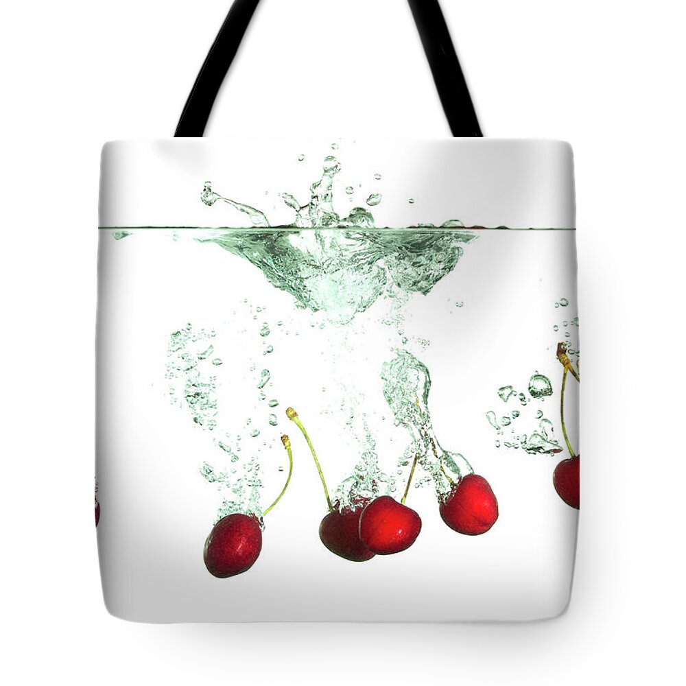 Cherry Tote Bag featuring the photograph Cherries Splash by Asbe