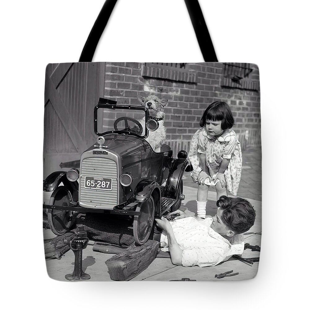 Vintage Tote Bag featuring the photograph Children And Dog Repairing 1920s Pedal Car by Retrographs