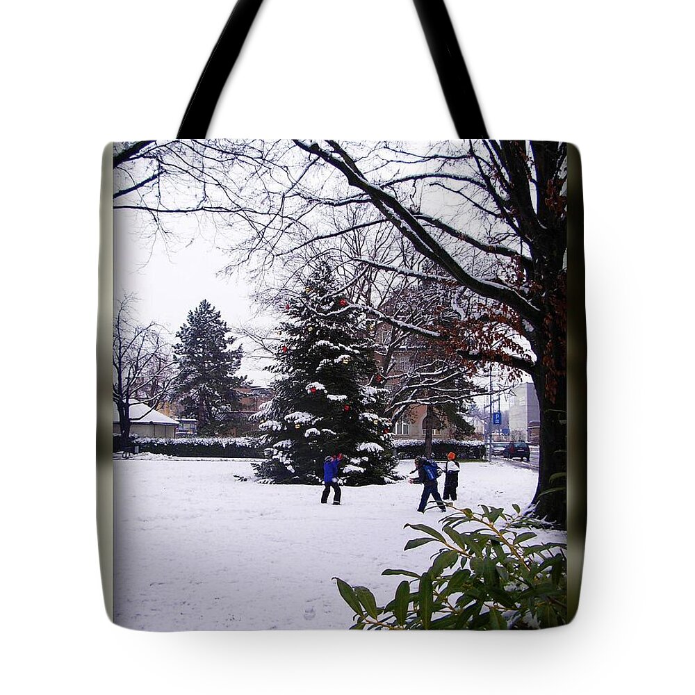 Christmas Tote Bag featuring the photograph Children playing near the Perennial Christmas Tree by Mariana Costa Weldon