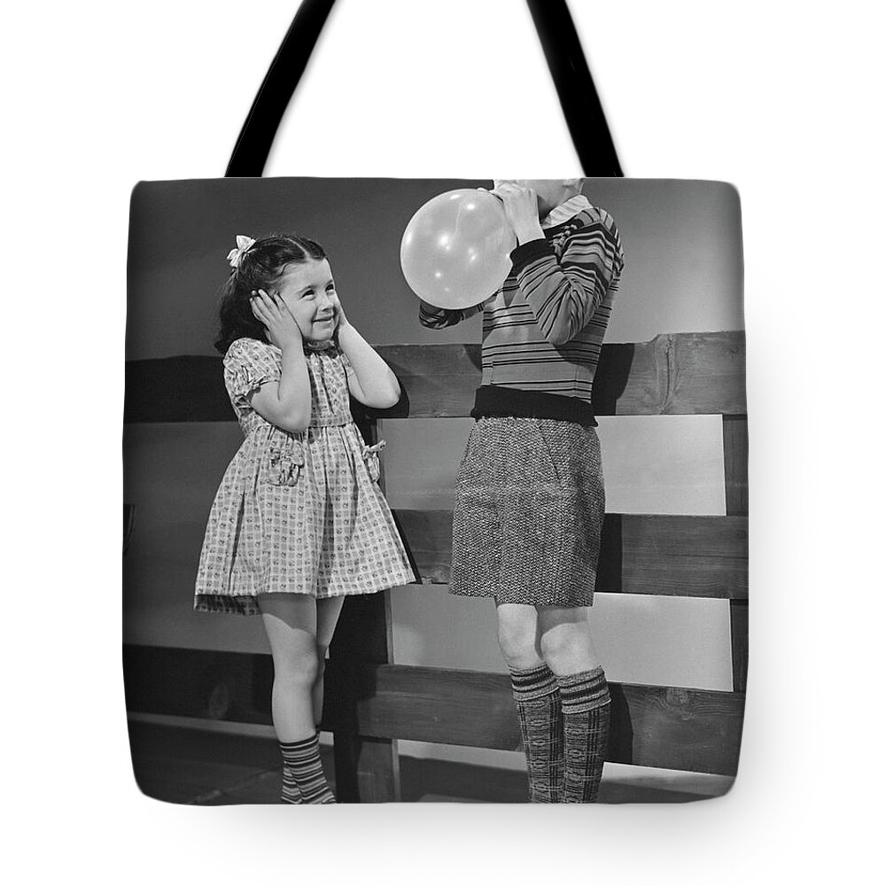 Child Tote Bag featuring the photograph Children Playing With Ballons by George Marks
