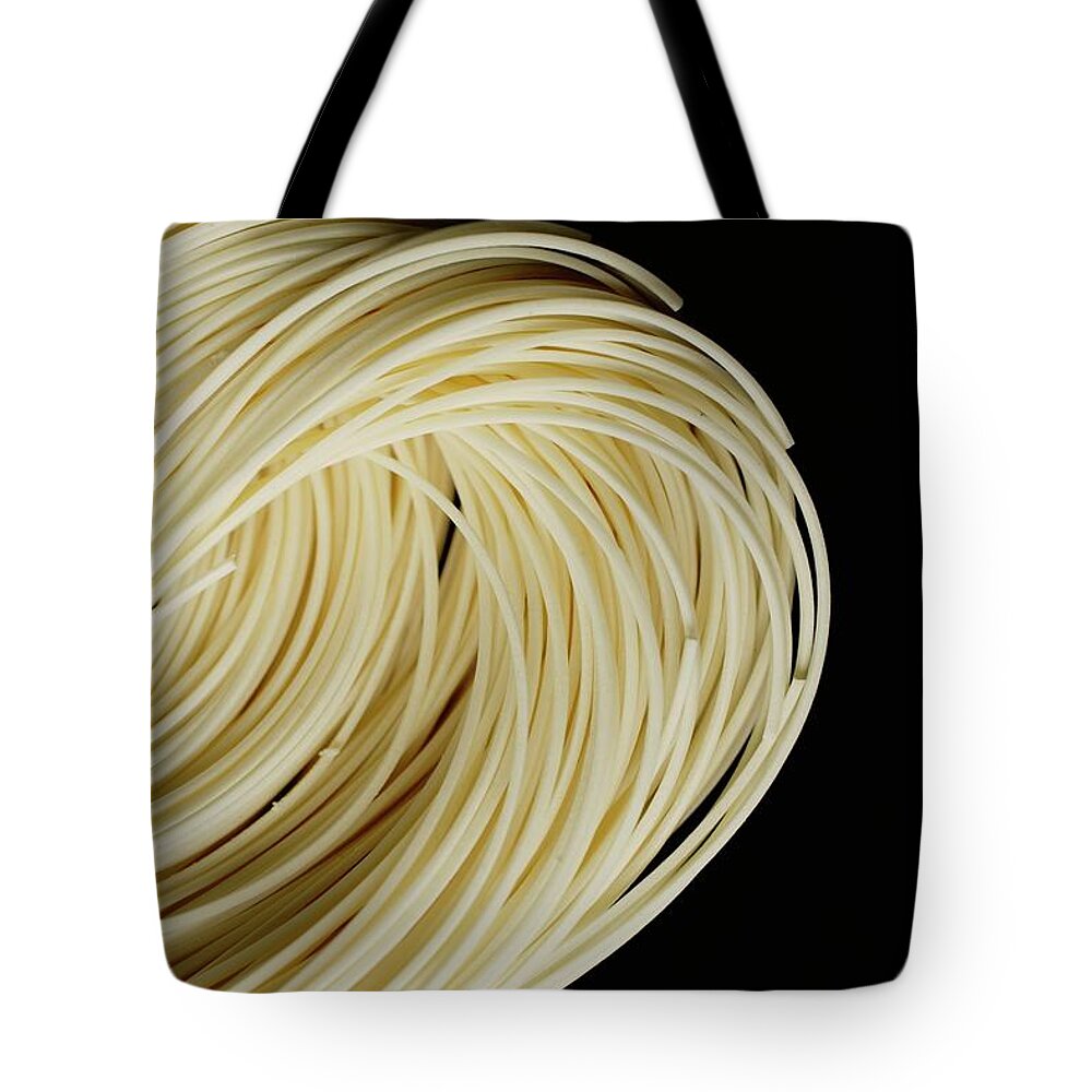 Black Background Tote Bag featuring the photograph Chinese Noodles Against Black by Asia Images Group
