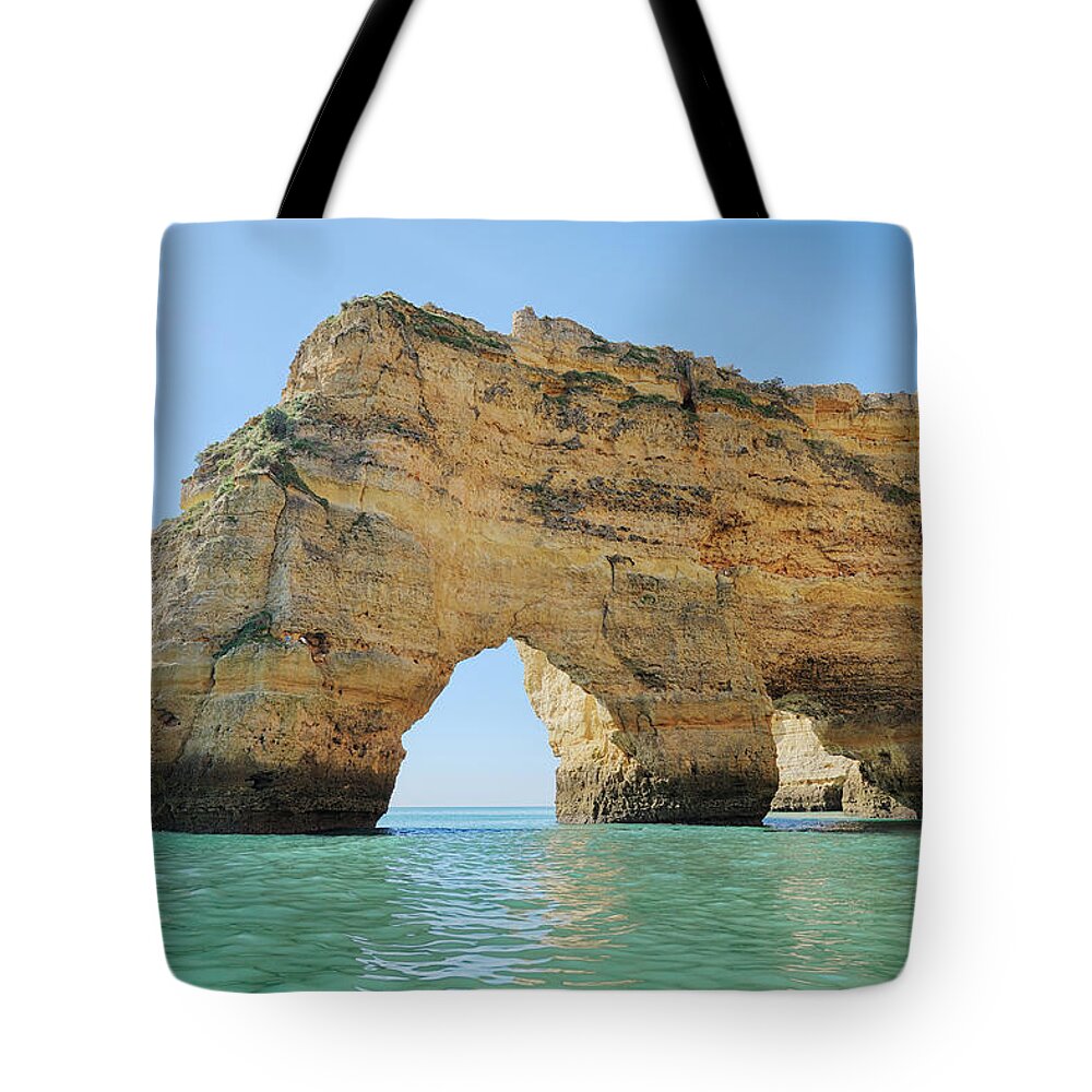 Algarve Tote Bag featuring the photograph Cliffs With Natural Arch by Martin Ruegner