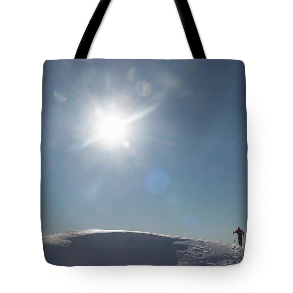 Chamonix Tote Bag featuring the photograph Climber Arriving On A Mountain Top by Buena Vista Images