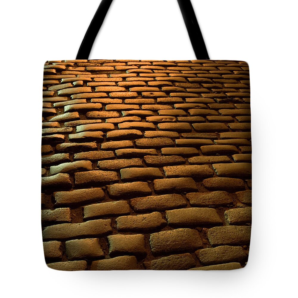 Outdoors Tote Bag featuring the photograph Close-up Of Cobblestone Street At Night by Jeff Spielman