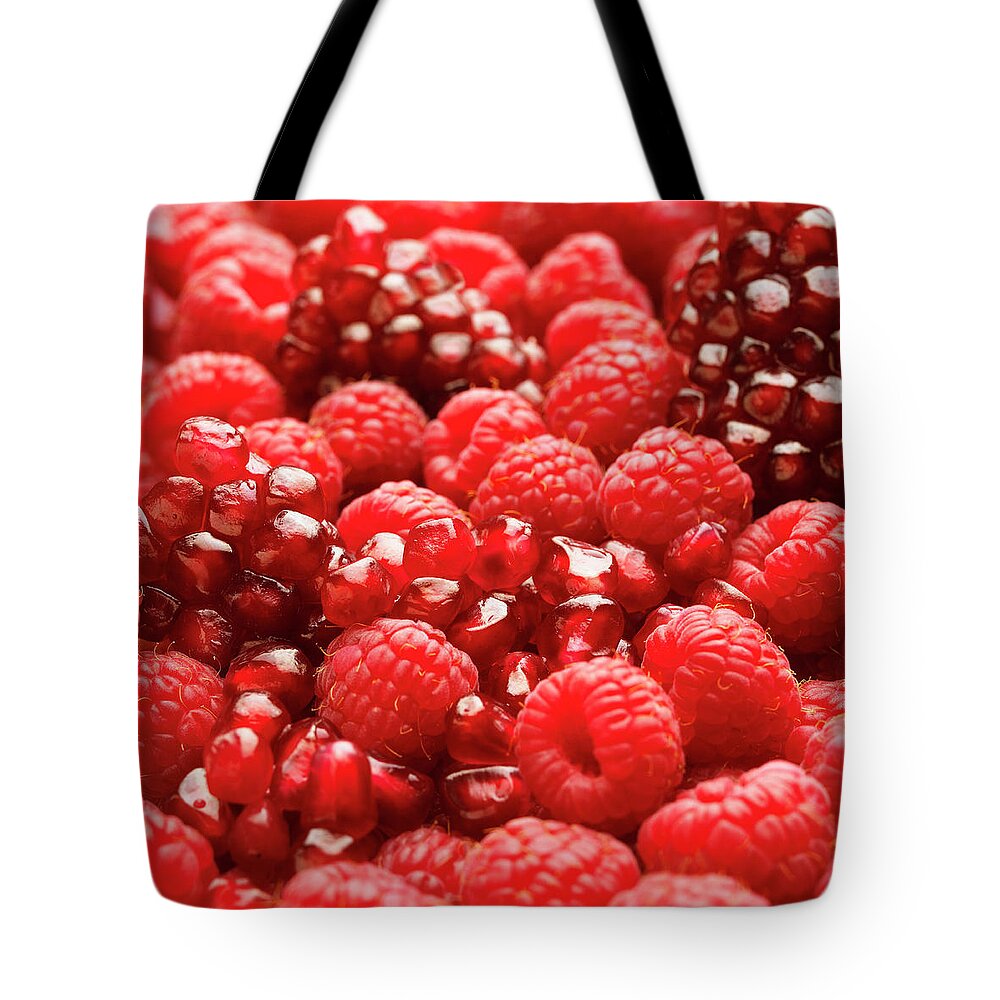 Vitamin Tote Bag featuring the photograph Close Up Of Fresh Raspberries And by Andrew Bret Wallis
